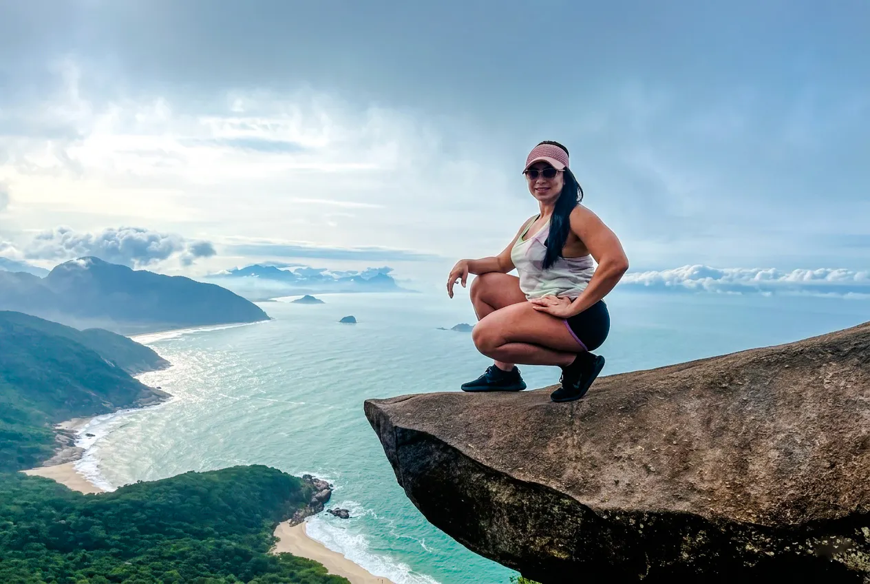 Person on Telegraph Stone with ocean view, Rio de Janeiro.