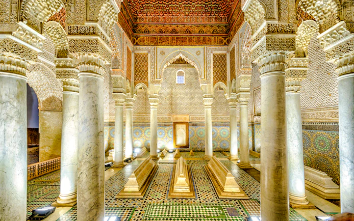 Saadian Tombs interior with ornate columns and intricate tilework in Marrakech, Morocco.