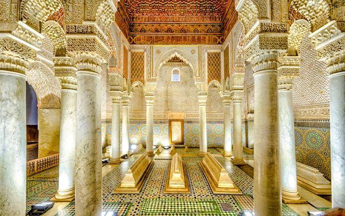 Saadian Tombs interior with ornate columns and intricate tilework in Marrakech, Morocco.