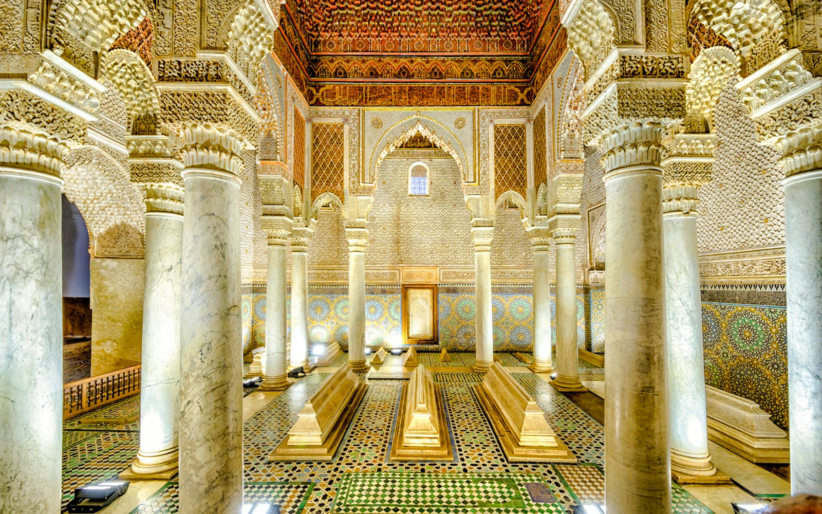 Saadian Tombs interior with ornate columns and intricate tilework in Marrakech, Morocco.