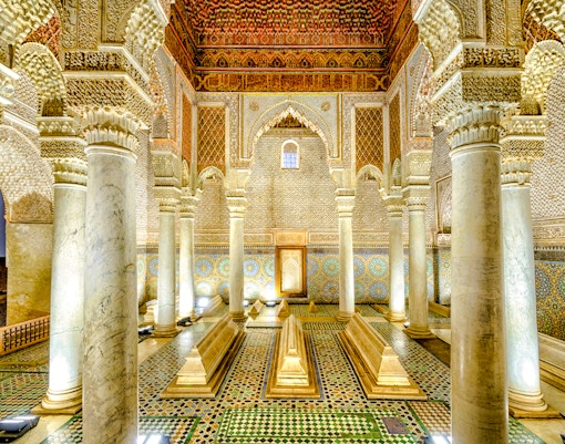 Saadian Tombs interior with ornate columns and intricate tilework in Marrakech, Morocco.