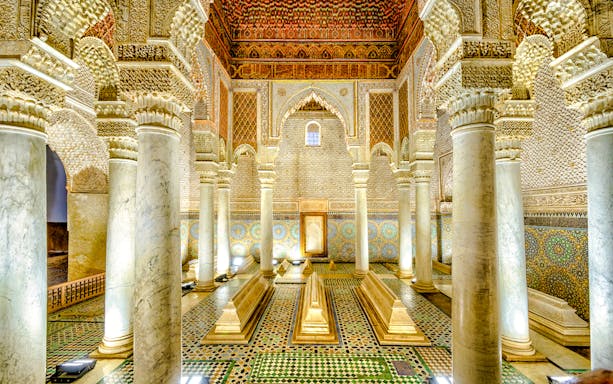 Saadian Tombs interior with ornate columns and intricate tilework in Marrakech, Morocco.