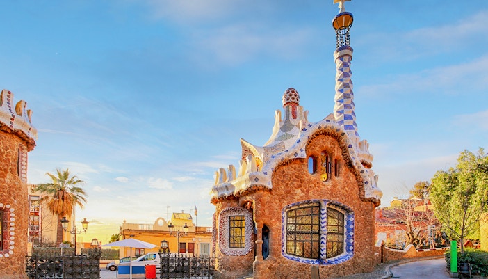 Colorful mosaic tiles and architectural structures at Park Güell, Barcelona, Spain.