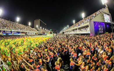 Salgueiro School rehearsal with vibrant costumes and large crowd, Rio de Janeiro.