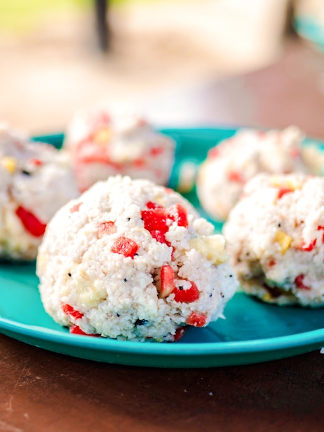 Rice balls with vegetables on a blue plate at Bukit Elephant Park.