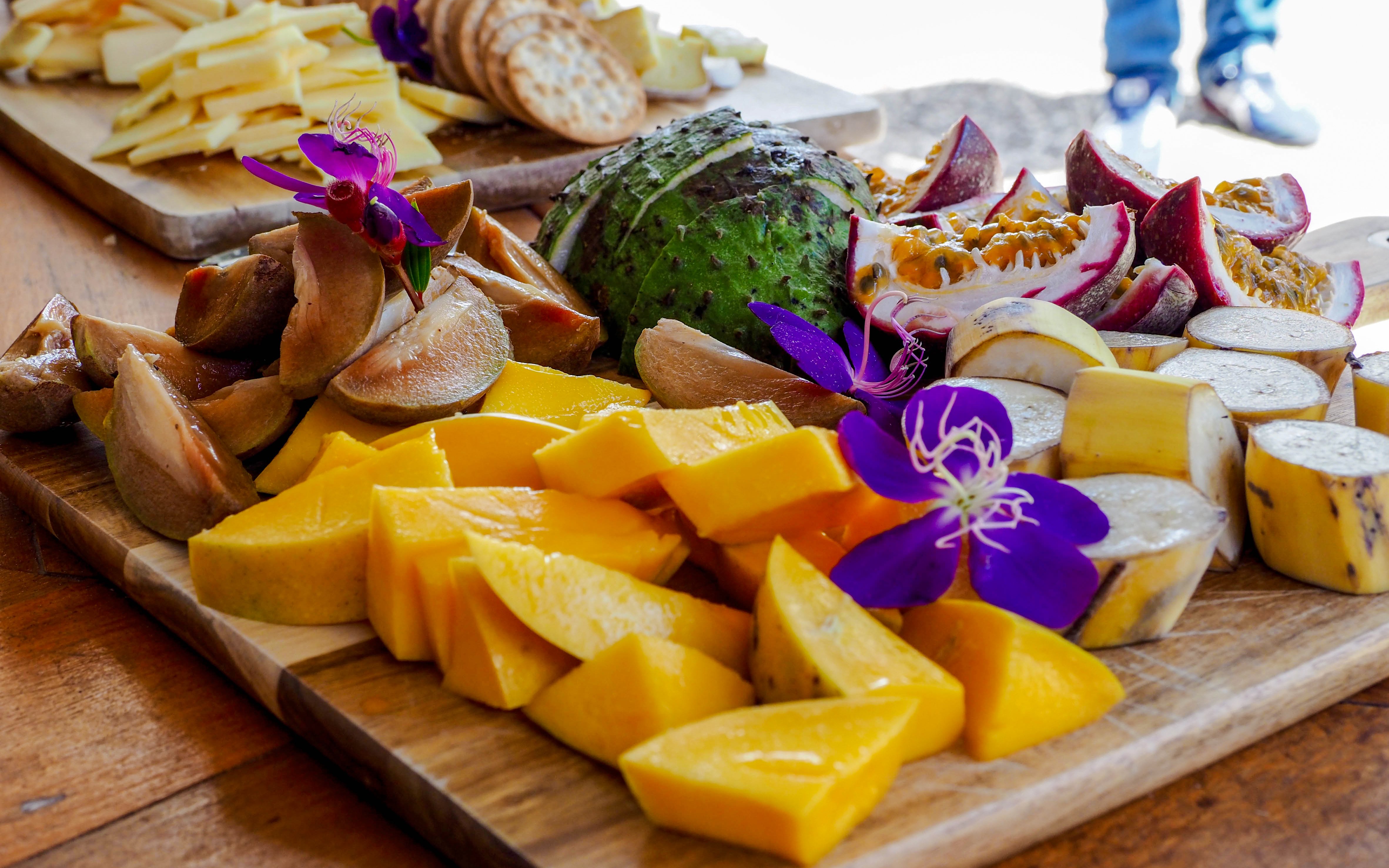 Tropical fruit platter with mango, bananas, and passion fruit on Billy Tea Safaris tour, Daintree & Cape Tribulation.