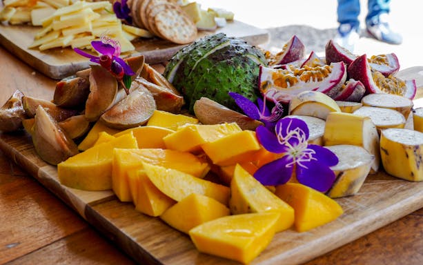 Tropical fruit platter with mango, bananas, and passion fruit on Billy Tea Safaris tour, Daintree & Cape Tribulation.