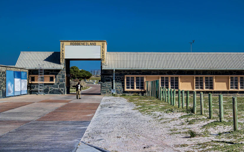 Robben Island entrance with welcome sign and pathway, South Africa.