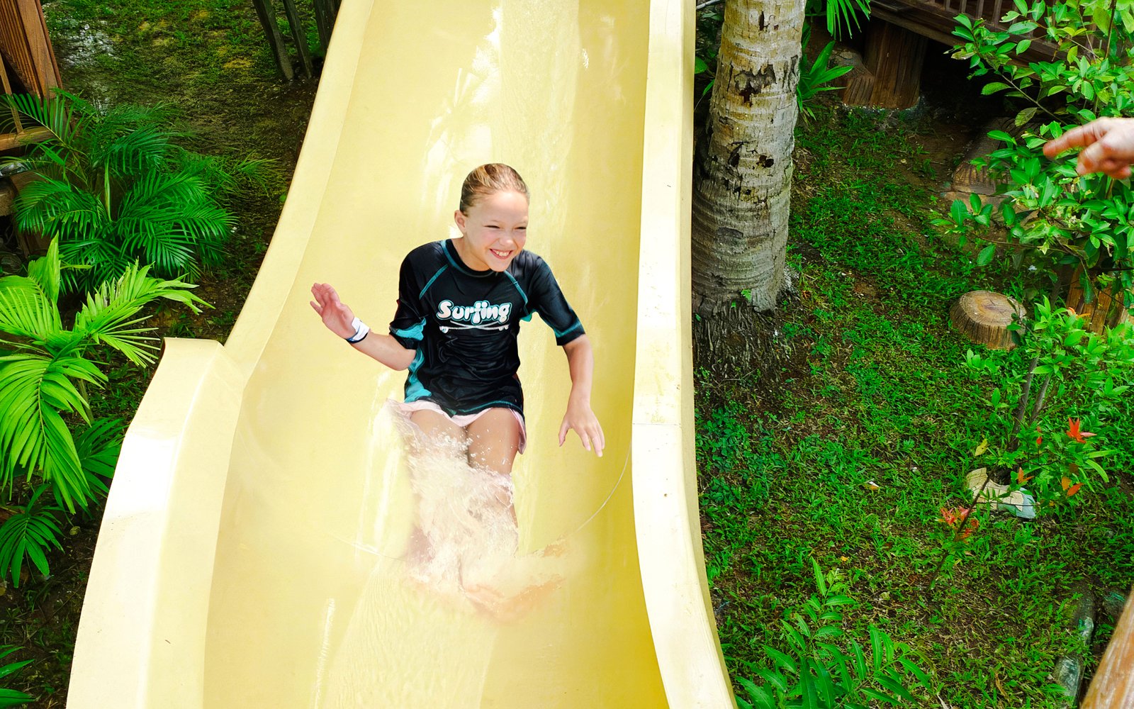Tourist sliding down water coaster at Wet World Water Park Shah Alam.