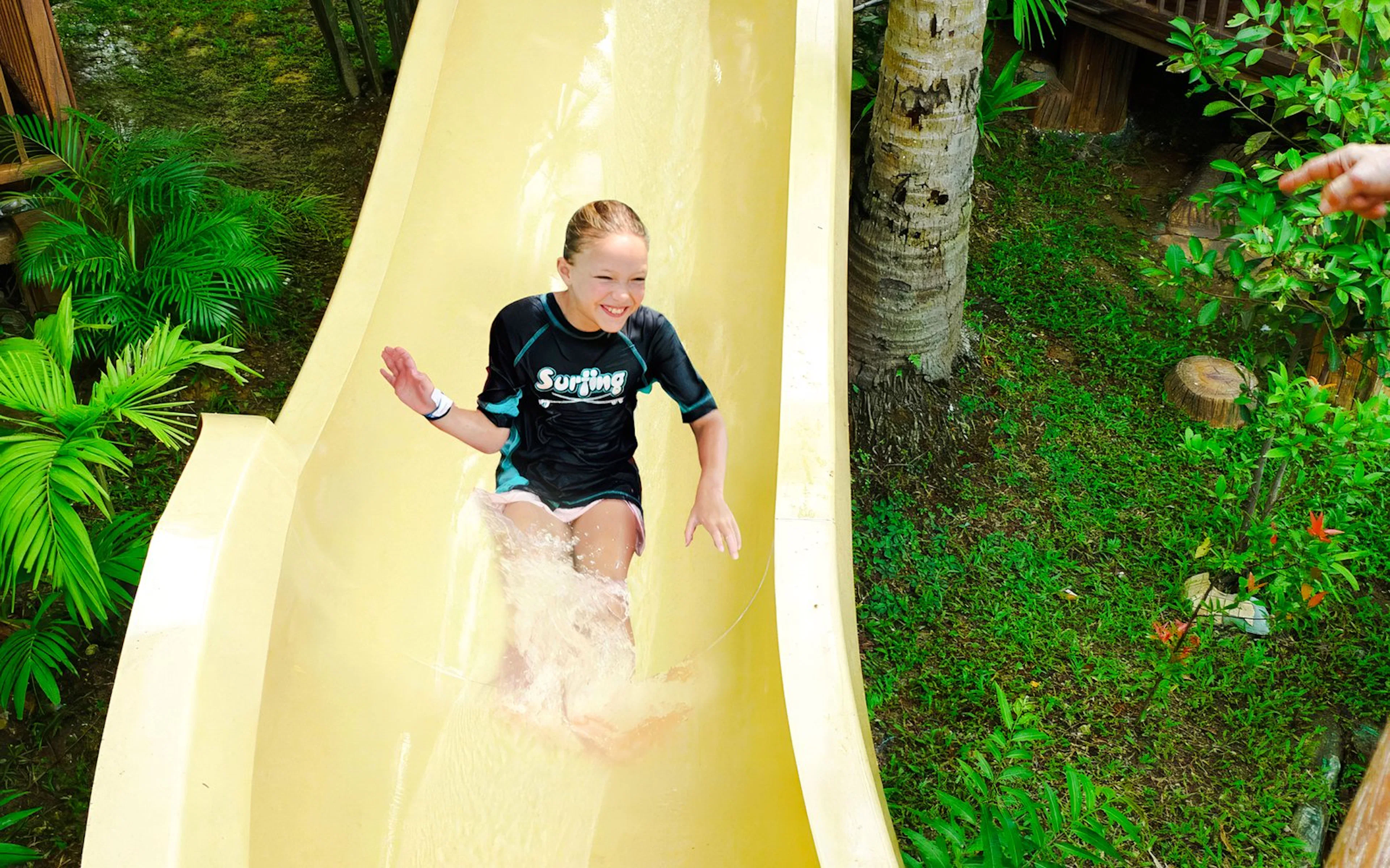 Tourist sliding down water coaster at Wet World Water Park Shah Alam.