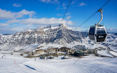 Ski resort with cable car and snowy mountains in Shahdag, Azerbaijan.