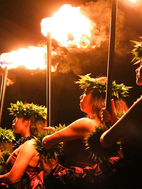 Performers with torches at Moana Luau, Hawaii.