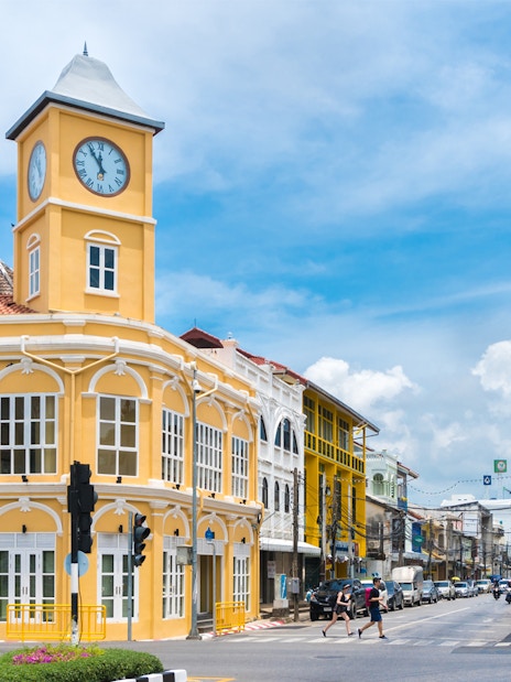Phuket Old Town clock tower and colonial buildings on a sunny day.