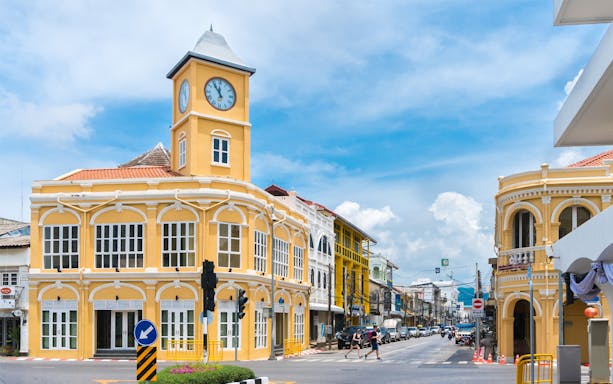 Phuket Old Town clock tower and colonial buildings on a sunny day.
