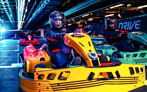 Guests driving go-karts at Elite F1 Drive experience in London.
