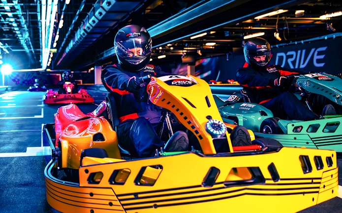 Guests driving go-karts at Elite F1 Drive experience in London.