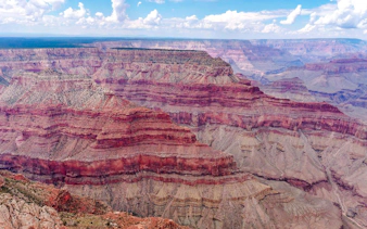 Grand Canyon South Rim aerial view with layered rock formations.