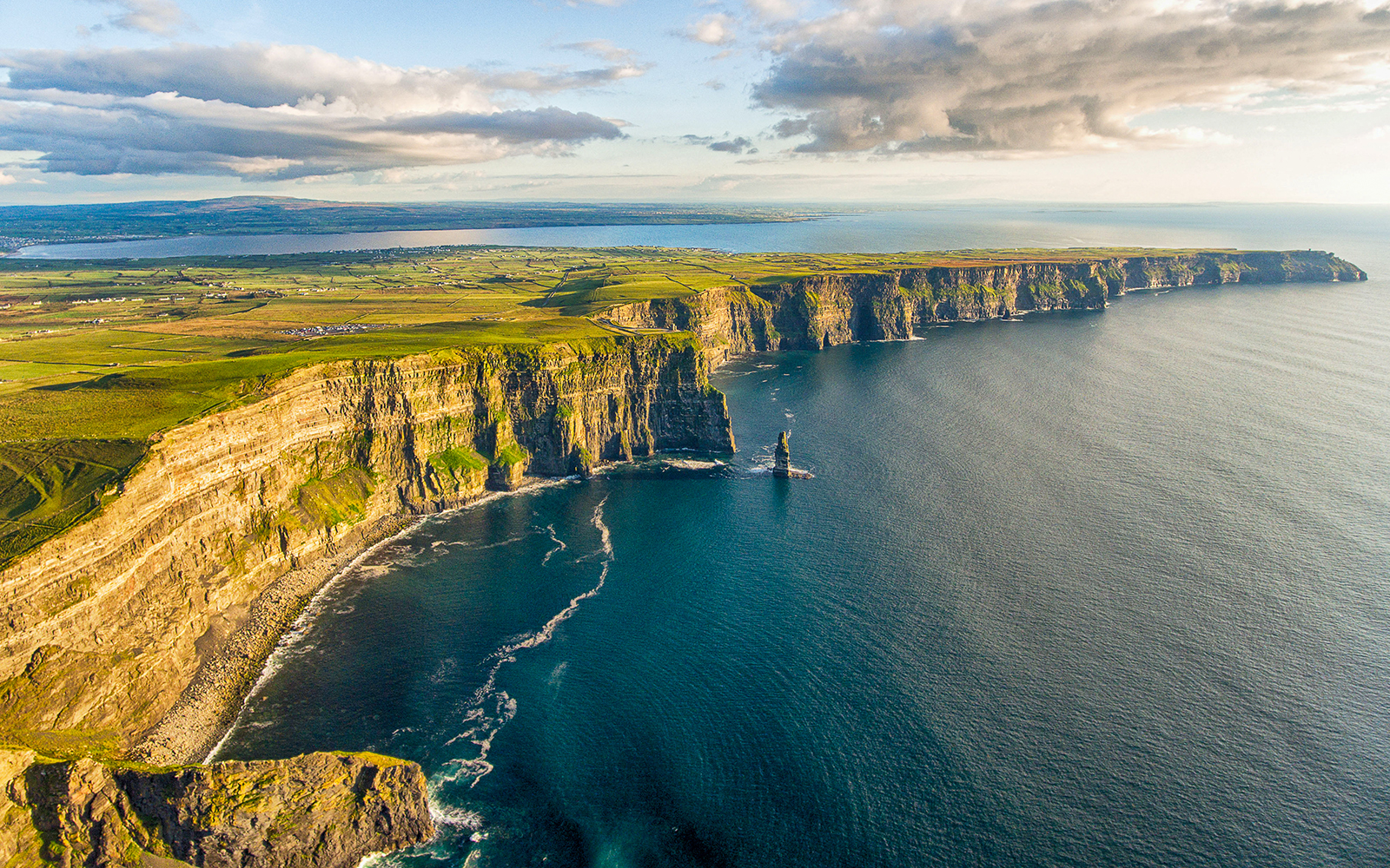 Aerial view of the Cliffs of Moher along the Atlantic Ocean in Ireland.