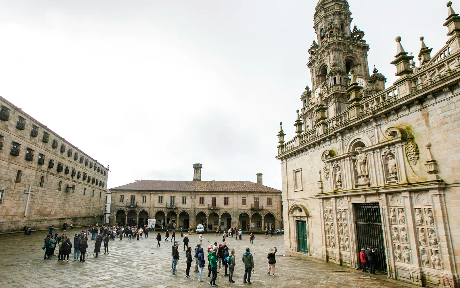 Tour group outside Santiago de Compostela Cathedral, Spain.