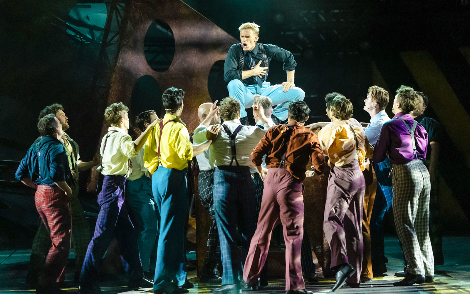 Performers in colorful costumes during "Guys & Dolls" on Sydney Harbour stage.