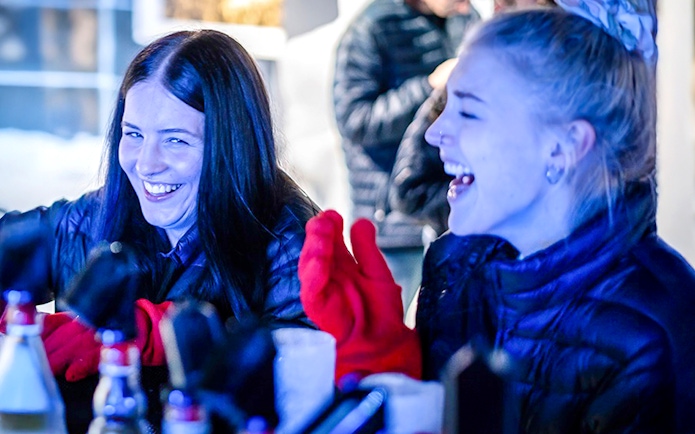Guests laughing and enjoying drinks at the Berlin Icebar.