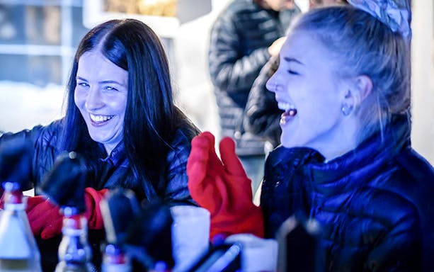 Guests laughing and enjoying drinks at the Berlin Icebar.