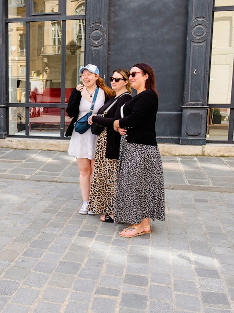 Guide taking Polaroid photos of guests on Emily in Paris Locations Walking Tour.