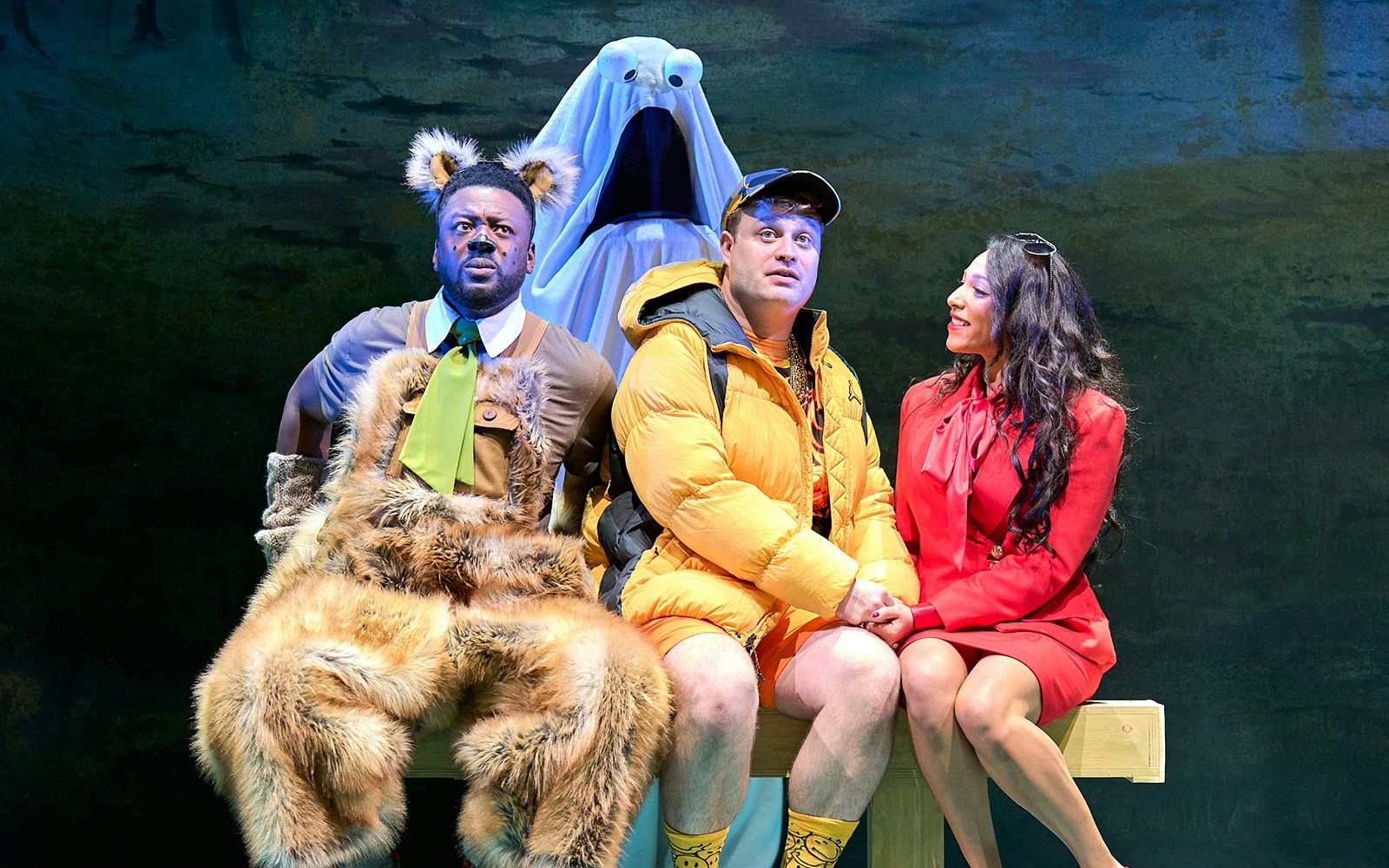 Mother Goose pantomime performance at London theater with colorful stage set.