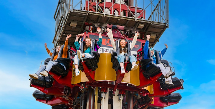 Visitors enjoying a drop tower ride at Thorpe Park.