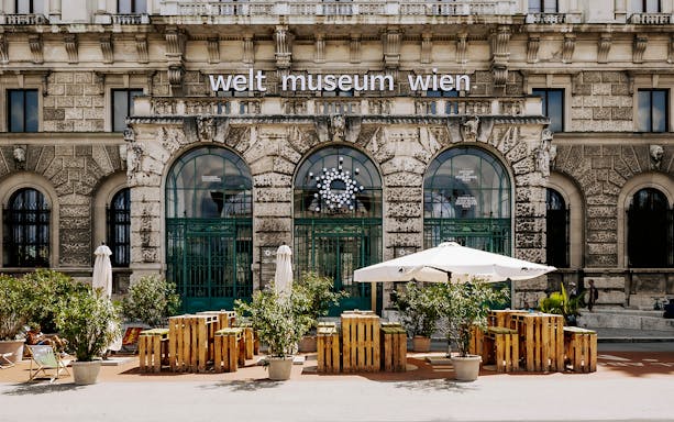 Weltmuseum Wien entrance with outdoor seating, Vienna City Card tour.
