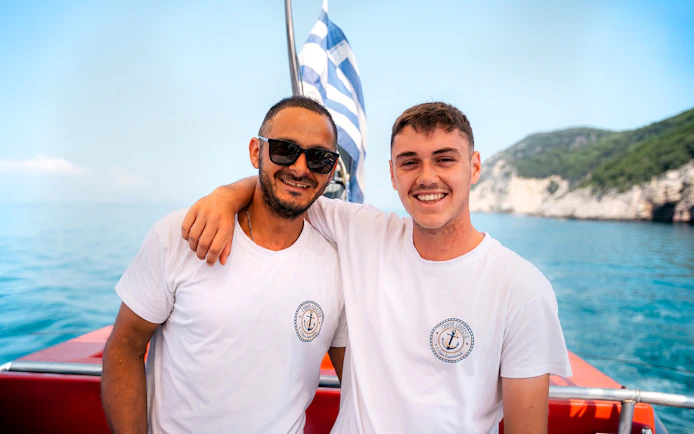 Crew members on a boat during Blue Lagoon & Papanikolis Cruise from Benitses/Lefkimmi.