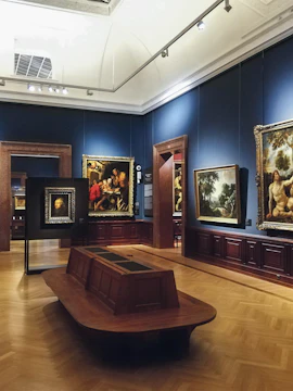 Interior of Budapest Museum of Fine Arts showcasing classic paintings in a gallery room.