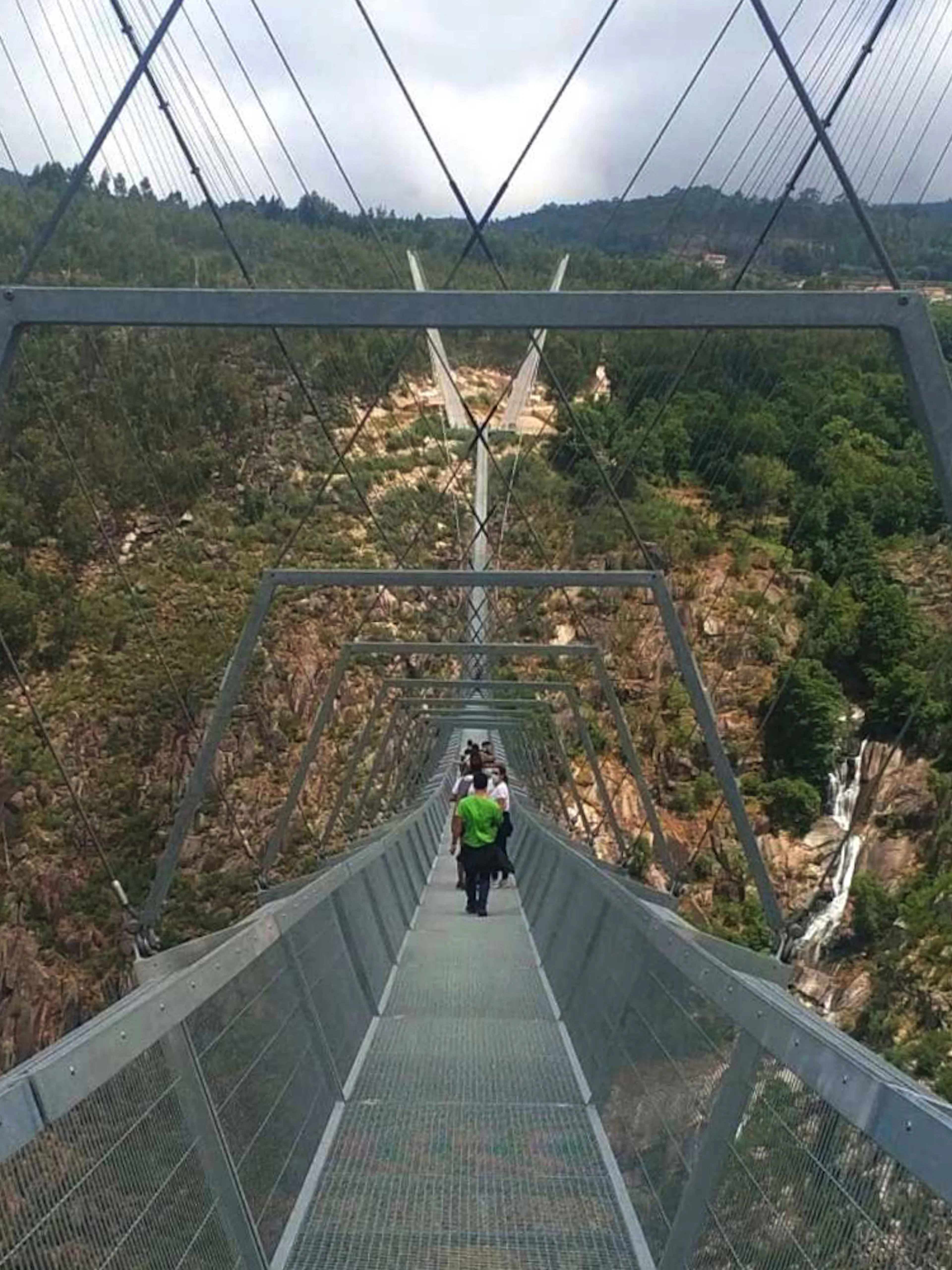 Guided tour on 516 Arouca Suspension Bridge with view of Paiva Walkways, Portugal.