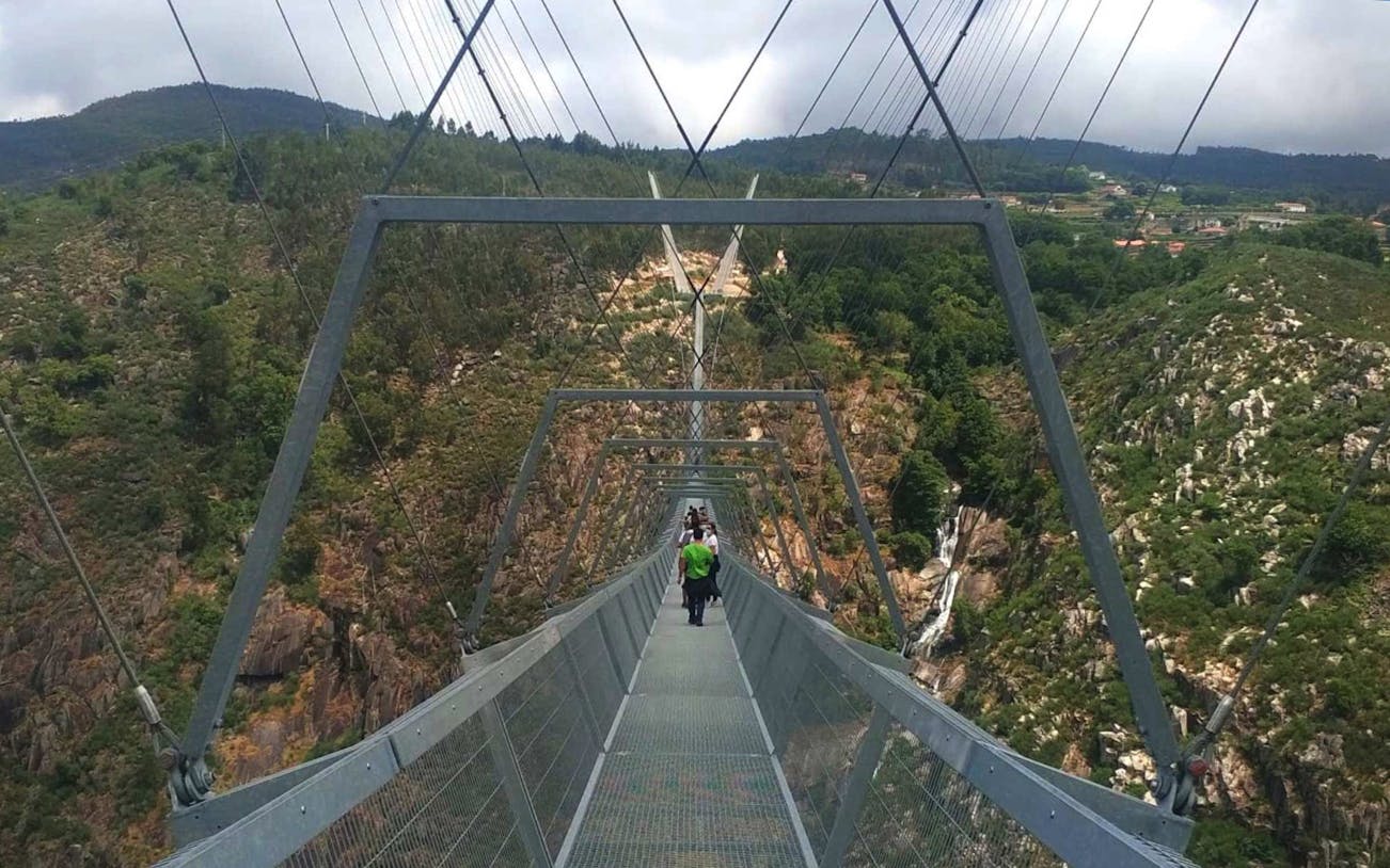 Guided tour on 516 Arouca Suspension Bridge with view of Paiva Walkways, Portugal.