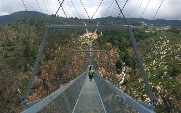 Guided tour on 516 Arouca Suspension Bridge with view of Paiva Walkways, Portugal.