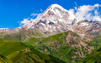 Mount Kazbek with Gergeti Trinity Church in the foreground, Georgia.