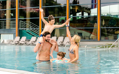 Family enjoying the pool at Terma Bania in Białka Tatrzańska, near Zakopane.
