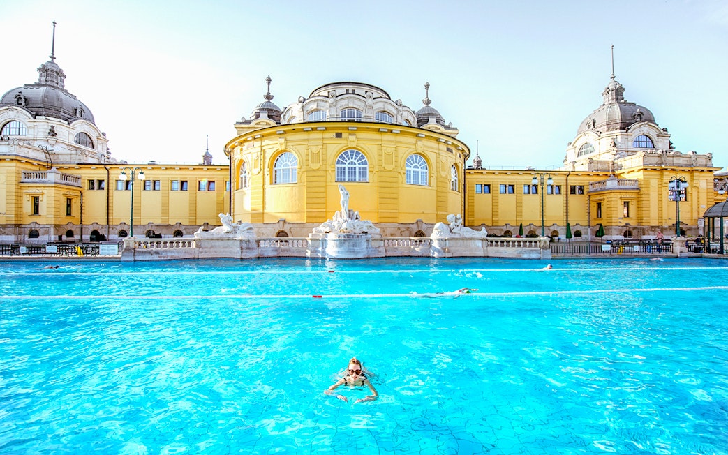 Guests swimming at Széchenyi Spa in Budapest, Hungary.