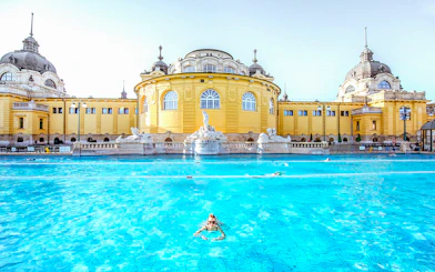 Guests swimming at Széchenyi Spa in Budapest, Hungary.