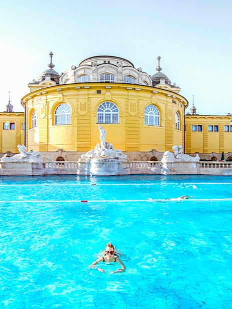 Guests swimming at Széchenyi Spa in Budapest, Hungary.