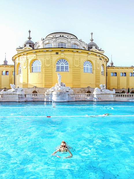 Guests swimming at Széchenyi Spa in Budapest, Hungary.