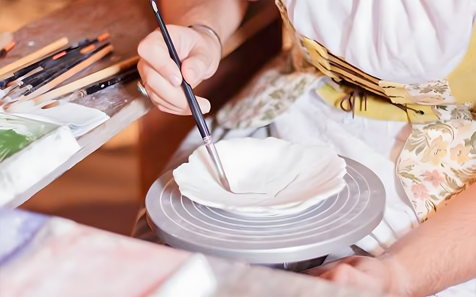Pottery painting demonstration at Puy du Fou, France.