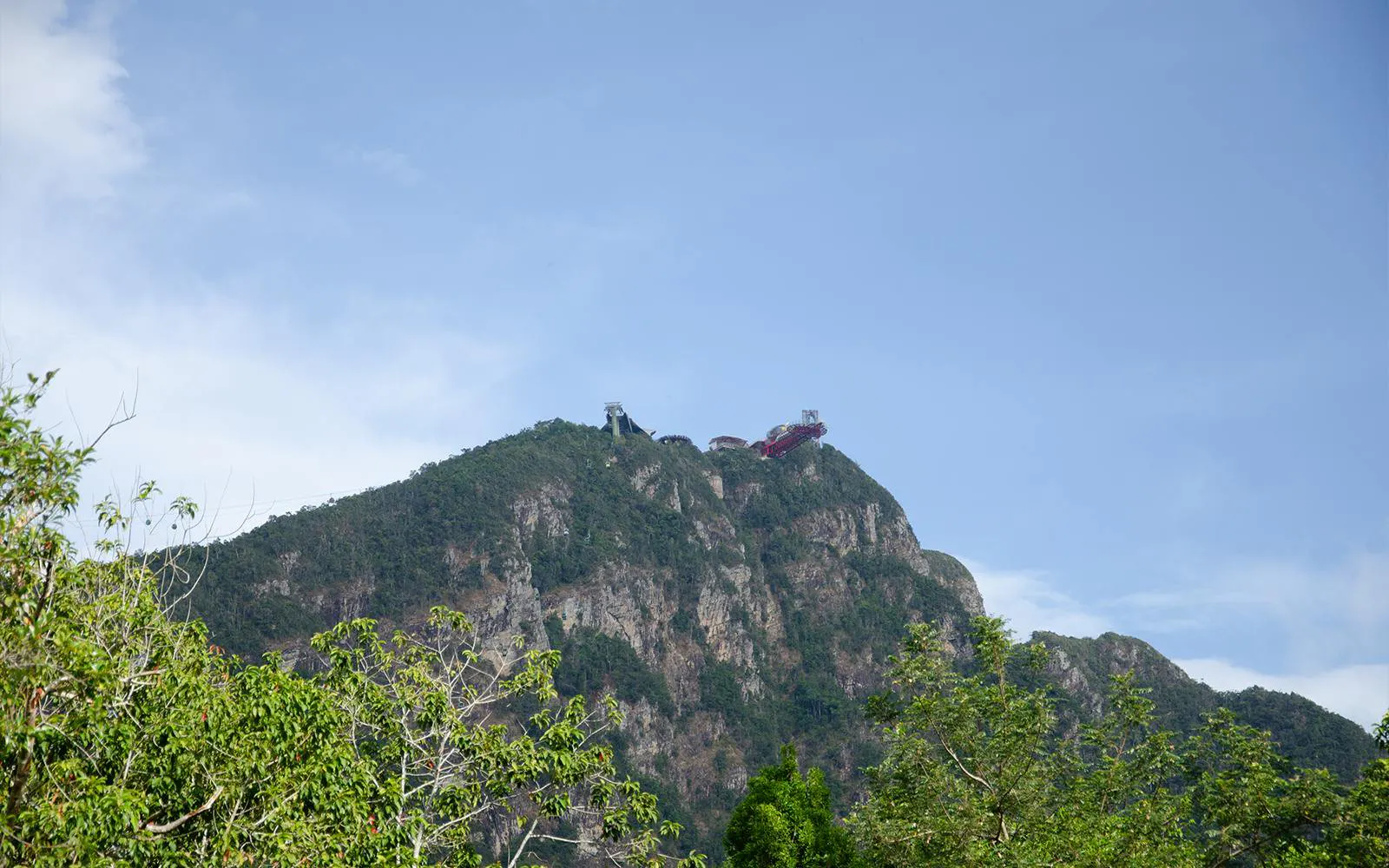 Langkawi Cable Car ascending Gunung Mat Cincang with SkyBridge visible at the peak.