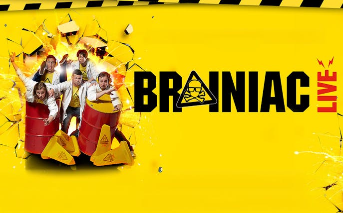 Performers in lab coats with barrels, promoting Brainiac Live! show.