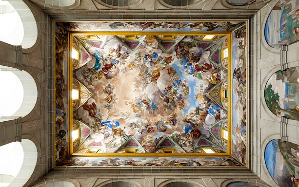 Ceiling fresco in San Lorenzo de El Escorial, depicting vibrant historical and religious scenes.