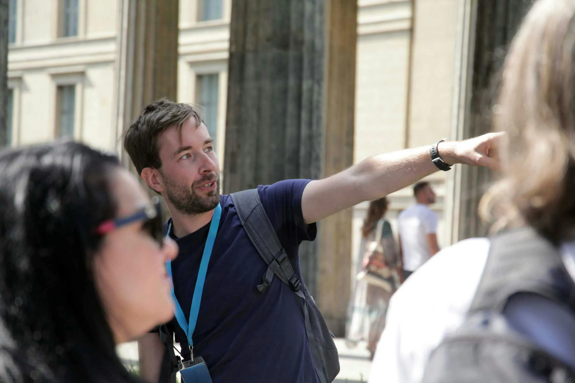 Guide explaining history during Berlin World War II and Third Reich walking tour.