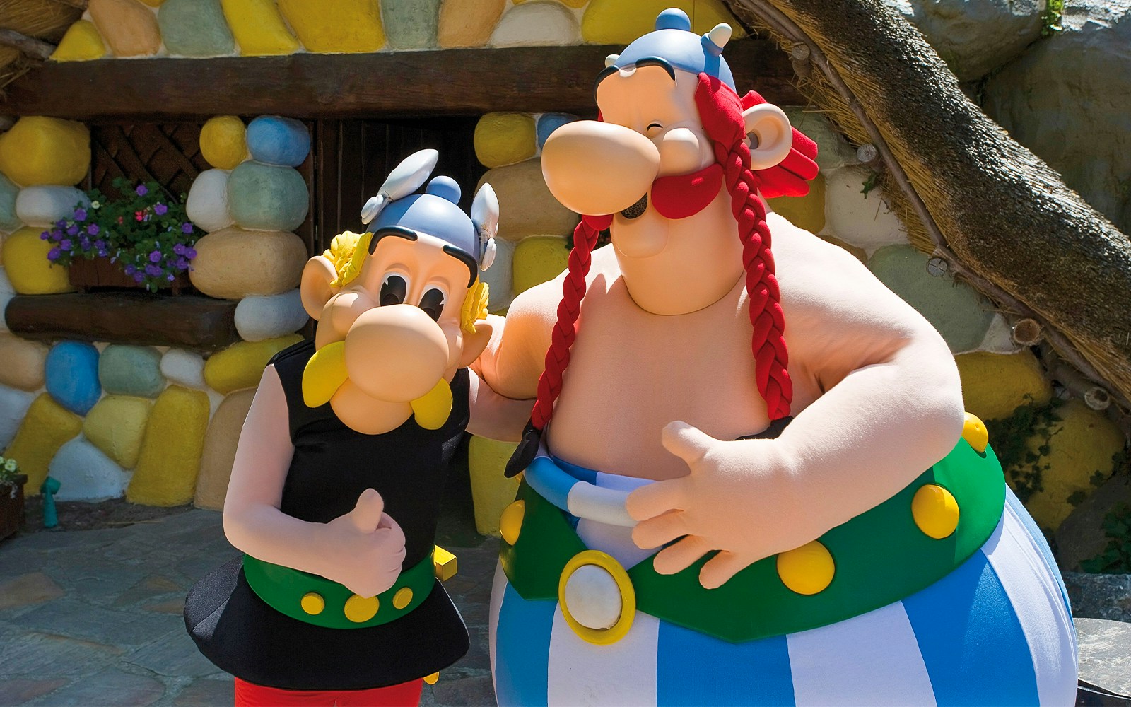 Visitors enjoying a roller coaster ride at Parc Asterix, France.