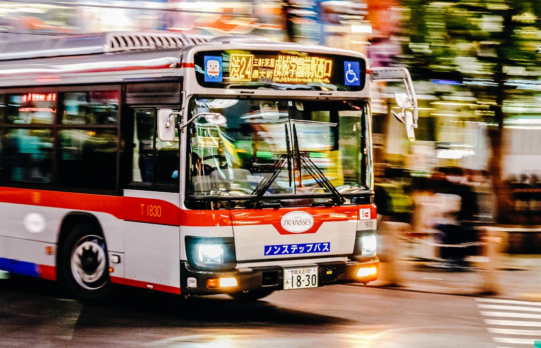 Red and white bus in Shibuya, Tokyo, Japan