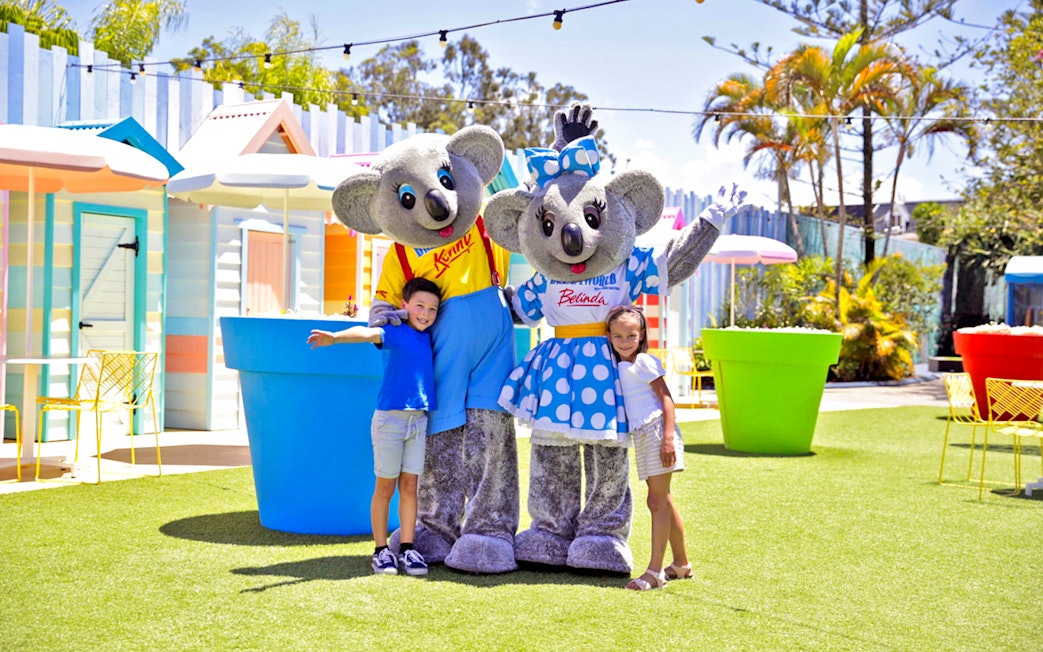 Children with koala mascots at Dream World Gold Coast, Australia.