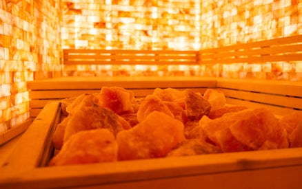 Salt room with warm lighting at QC Terme Chamonix spa.